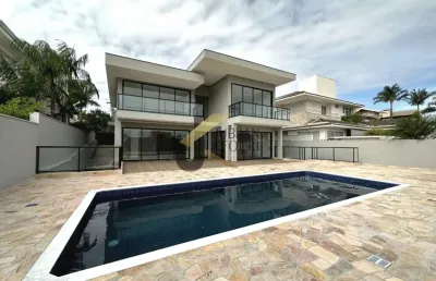 Casa para aluguel no alphaville campinas, com 4 suítes, lazer comum e garagem para vários carros.