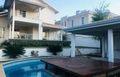 Casa no alphaville campinas para venda, com 4 suítes (1 suíte - máster com closet), piscina, espaço gourmet e 4 garagens.