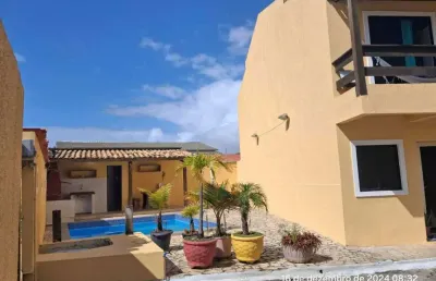 Casa térrea, tipo village, 2/4, 1 vaga, condomínio próximo a praia de ipitanga, stella maris, salvador/ba.