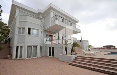 Casa em condomínio fechado com 6 quartos para alugar na alameda itatiaia, 304, alphaville, santana de parnaíba por r$ 65.000