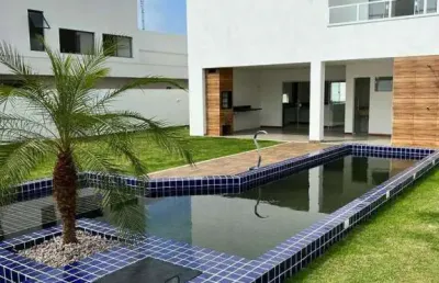 Vendo casa nova recém construída com 50mm2, piscina privativa, espaço gourmet , área verde, jardim, 4 suítes no condomínio parque de jacuípe com rio e mar para ir andando.