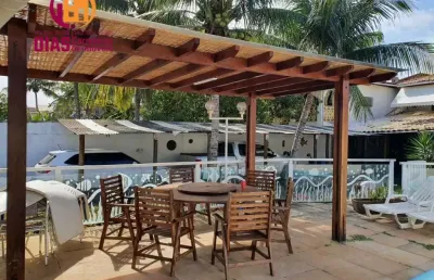 Vendo em oportunidade 2 casas em um terreno com 518m2 de área total com clube com piscina  espaço gourmet garagem coberta com 5/4, sendo 3 suítes em ipitanga próximo praia  em rua familiar e super seg