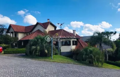 Casa em condomínio fechado com 3 quartos à venda na dos papagaios, 20, centro, canela, 370 m2 por r$ 3.000.000