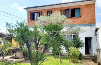 Casa com 3 quartos à venda na rua vinte e cinco de julho, 55, santa maria goretti, porto alegre, 292 m2 por r$ 790.000