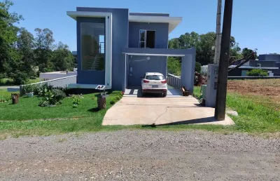 Casa moderna com piscina e suíte master no condomínio ninho verde i - porangaba, sp