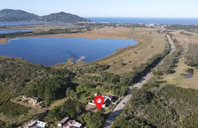 Terreno em condomínio fechado à venda na joão joaquim da silva, 200, encantada, garopaba por r$ 450.000