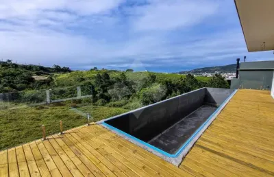 Casa em condomínio fechado com 3 quartos à venda na servidao pmg 652, 109, ferraz, garopaba por r$ 1.950.000
