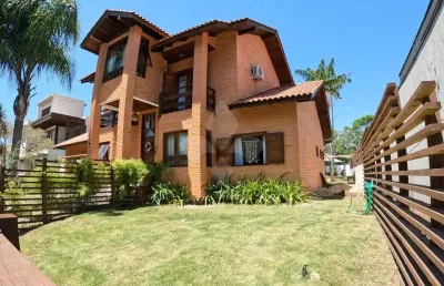 Casa em condomínio fechado com 4 quartos à venda na rodovia doutor antônio luiz moura gonzaga, 647, rio tavares, florianópolis por r$ 4.500.000