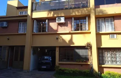 Casa em condomínio fechado com 3 quartos à venda na rua general gomes carneiro, 80, medianeira, porto alegre por r$ 630.000