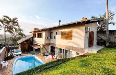 Casa com 4 dormitórios à venda, 248 m² por r$ 690.000,00 - encosta do sol - estância velha/rs