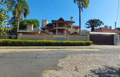 Casa com 4 quartos à venda na Rua Paissandu, 361, Partenon, Porto Alegre