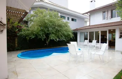 Casa em condomínio fechado com 4 quartos à venda na avenida do ipê amarelo, 94, lagoa da conceição, florianópolis, 300 m2 por r$ 7.000.000
