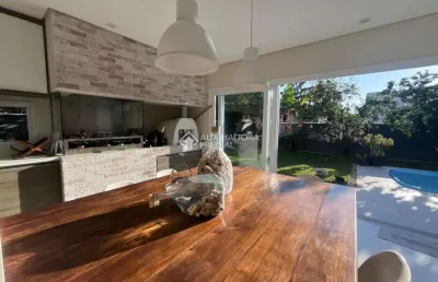 Casa em condomínio fechado com 3 quartos à venda na rodovia doutor antônio luiz moura gonzaga, 3825, rio tavares, florianópolis, 303 m2 por r$ 4.200.000