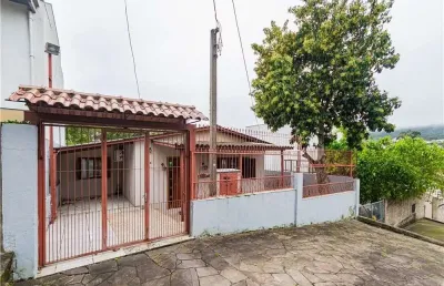Casa em condomínio fechado com 3 quartos à venda na Rua Cunha Neto, 334, Nonoai, Porto Alegre
