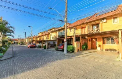 Casa em condomínio fechado com 3 quartos à venda na Avenida Edgar Pires de Castro, 1286, Hípica, Porto Alegre