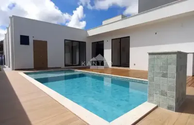 Casa linear com 3 suítes sendo uma master, piscina , portaria 24 horas no residencial alvim