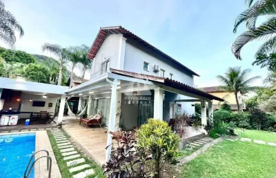 Casa espetacular em condomínio nobre de vargem grande com 4 suítes, piscina e energia solar