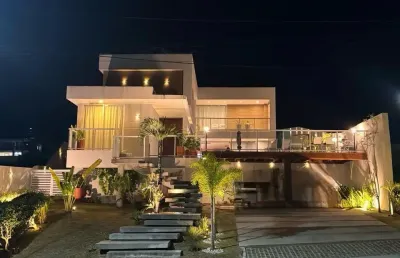 Casa a venda 4 suítes porteira fechada  no alphaville litoral norte 3