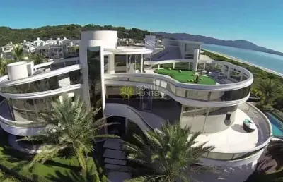Linda mansão frente mar em jurerê internacional, para venda e locação de temporada, totalmente auto