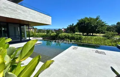 Casa de luxo à venda no joinville country club – 5 suítes, piscina com raia e automação completa!