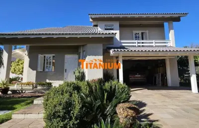 Casa à venda com 4 dormitórios, piscina, área gourmet, maravilhoso jardim no bairro ideal em novo hamburgo.