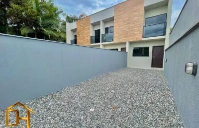 Sobrado geminado com 2 suítes e 2 vagas de garagem no bairro rio bonito