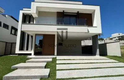 Casa com piscina em frente à praça - 5 suítes - condomínio alphaville ii