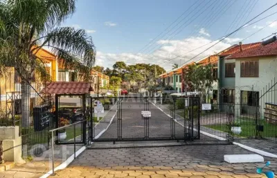 Casa em condomínio fechado com 3 quartos à venda na avenida juca batista, 4075, hípica, porto alegre, 99 m2 por r$ 390.000