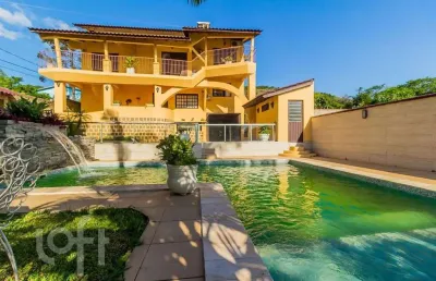 Casa com 4 quartos à venda na rua maurílio ferreira, 320, campo novo, porto alegre, 320 m2 por r$ 1.850.000
