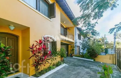Casa com 3 quartos à venda na rua andré primo biazetto, 414, campo novo, porto alegre, 330 m2 por r$ 1.100.000