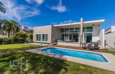 Casa em condomínio fechado com 4 quartos à venda na avenida juca batista, 8000, belém novo, porto alegre, 421 m2 por r$ 3.200.000