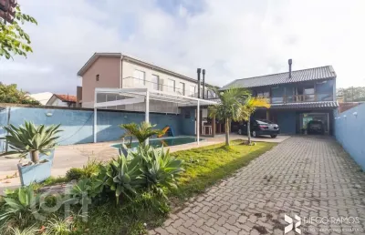 Casa com 4 quartos à venda na rua jerolomo minuzo, 317, vila nova, porto alegre, 304 m2 por r$ 900.000