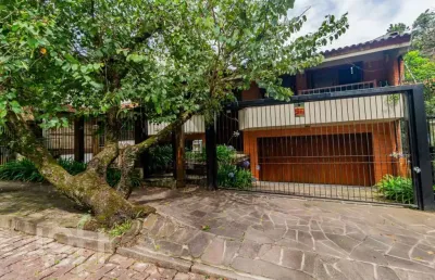 Casa com 4 quartos à venda na rua alcebíades antônio dos santos, 157, nonoai, porto alegre, 362 m2 por r$ 1.650.000