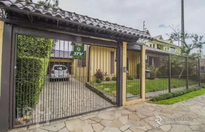 Casa com 3 quartos à venda na rua professor guerreiro lima, 585, partenon, porto alegre, 240 m2 por r$ 1.200.000