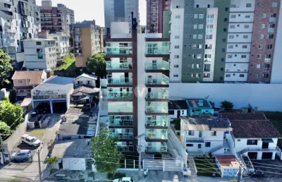 Apartamento semimobiliado de dois dormitórios sendo um suíte.