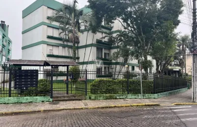 Apartamento amplo de 3 dormitórios com dependência, localizado no centro da cida