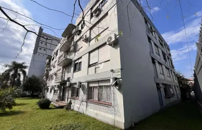 Apartamento  com 2 dormitórios, dependência completa e churrasqueira, localizado