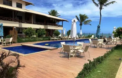 Village superior duplex mobiliado 2 quartos sendo 1 suíte 75m2 em itacimirim duas vagas de garagem frente mar