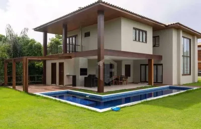 Casa a venda em praia do forte, litoral norte da bahia - condomínio praia bella, acesso direto à praia, 5 suítes de alto padrão com móveis inclusos.