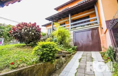 Casa com 5 quartos à venda na Rua Ângelo Passuelo, --, Vila Nova, Porto Alegre