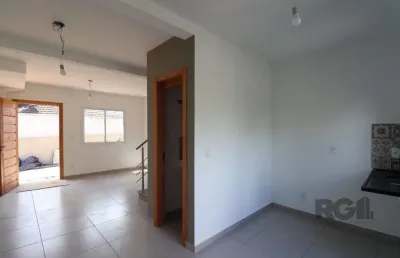 Casa em condomínio fechado com 2 quartos à venda na Rua Miguel Ascoleze, --, Vila Nova, Porto Alegre