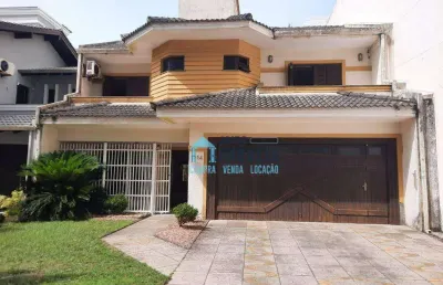 Sobrado com 4 dormitórios(sendo 2 suítes) à venda por r$ 960.000 - centro - tramandaí/rs