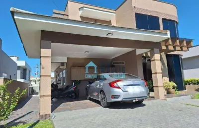 Casa de alto padrão, 3 suítes e piscina à venda, 290 m² por r$ 1.590.000 - condomínio marítimo - tramandaí/rs