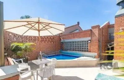 Casa em condomínio fechado com 3 quartos à venda na Avenida Jacuí, 978, Cristal, Porto Alegre