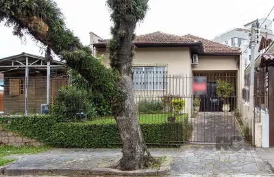 Casa térrea, 2 quartos, 2 vagas, edicula com 1 quarto e um banheiro - bairro tri