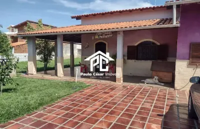 Casa com 02 quartos sala cozinha banheiro área de serviço varandas garagem anexo varandas com churrasqueira 01 banheiro e 01 quarto. mais terreno anex
