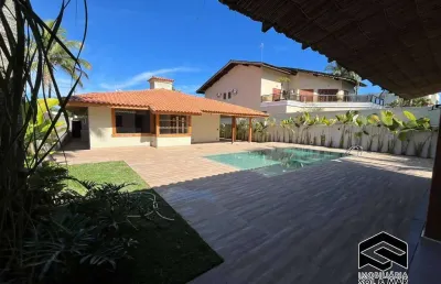 Casa térrea nova estilo trancoso, no condomínio jardim acapulco ii