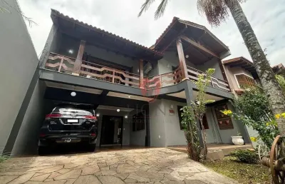 Sobrado com 4 dormitórios à venda, 320 m² por r$ 1.170.000 - girassol - gravataí/rs
