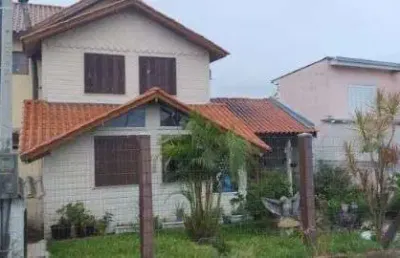 Casa com 3 quartos à venda na Rua dos Guenoas, 72, Guarujá, Porto Alegre