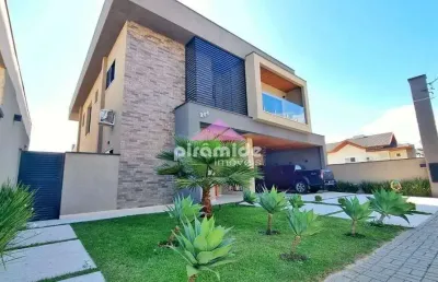 Casa com 4 dormitórios à venda, 400 m² por r$ 4.100.000,00 - condomínio residencial jaguary - são j